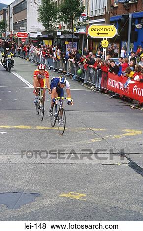 Stock Photo - Road Racing Cyclists in Town. Fotosearch