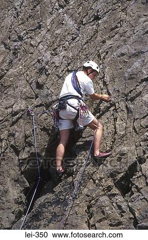 Rock Climber Three Cliffs Bay Wales UK View Large Photo Image Stock Image - Rock Climber Three Cliffs Bay Wales UK. Fotosearch