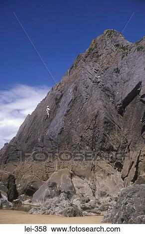 Rock Climber Three Cliffs Bay Wales UK View Large Photo Image Stock Photo - Rock Climber Three Cliffs Bay Wales UK. Fotosearch