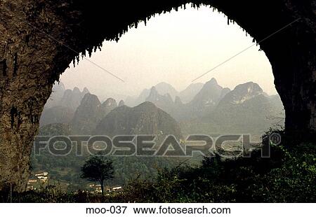 Rock Formations Framed in Huge Natural Arch China View Large Photo Image Stock Photo - Rock Formations Framed in Huge Natural Arch China. Fotosearch