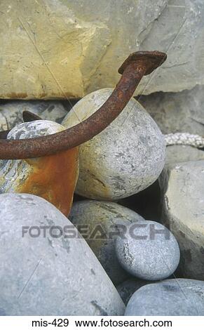 Rusting Metal on Pebbles View Large Photo Image Stock Photo - Rusting Metal on Pebbles. Fotosearch