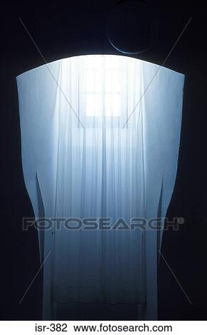 Stock Image - Shafts of Light Entering through Window. Fotosearch