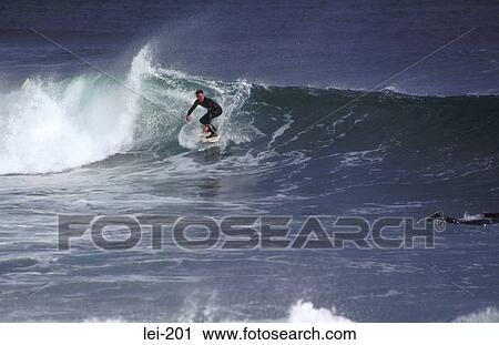 Stock Image - Surfer in Action Ireland. Fotosearch