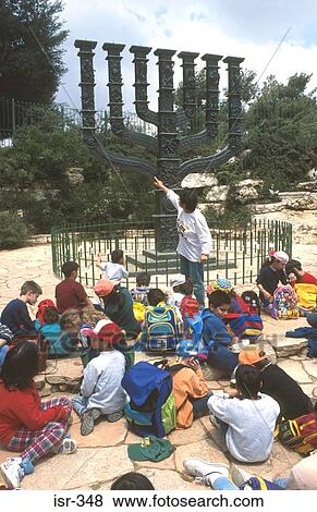Teacher Pointing Out Menorah to Children Israel View Large Photo Image Stock Photo - Teacher Pointing Out Menorah to Children Israel. Fotosearch