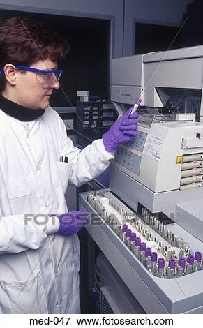 Technician Operating Automated Reagent Equipment UK View Large Photo Image Stock Photo - Technician Operating Automated Reagent Equipment UK. Fotosearch