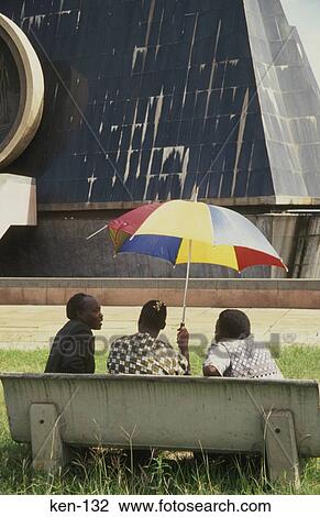 Three Men and an Umbrella Nairobi Kenya View Large Photo Image Stock Image - Three Men and an Umbrella Nairobi Kenya. Fotosearch
