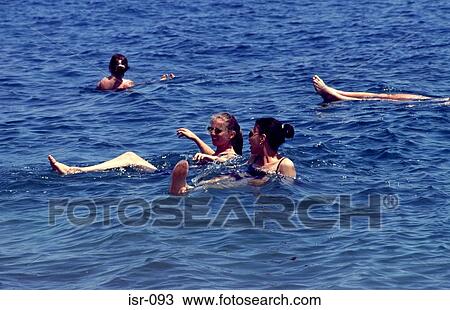 Tourists Floating on the Dead Sea Israel View Large Photo Image Stock Image - Tourists Floating on the Dead Sea Israel. Fotosearch