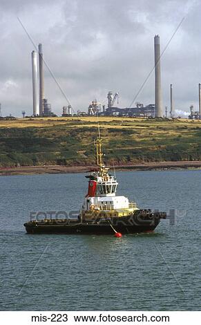 Tug Boat by Oil Refinery Milford Haven UK View Large Photo Image Stock Image - Tug Boat by Oil Refinery Milford Haven UK. Fotosearch