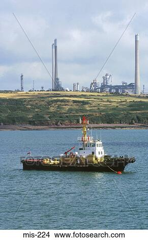 Tug by Petrochemical Refinery Wales UK View Large Photo Image Picture - Tug by Petrochemical Refinery Wales UK. Fotosearch