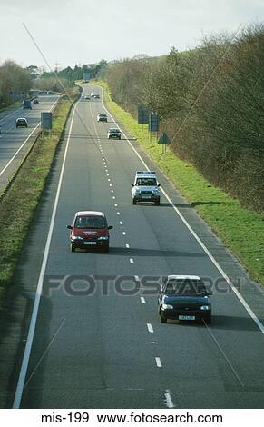 Vehicles on Main Road UK View Large Photo Image Stock Photo - Vehicles on Main Road UK. Fotosearch
