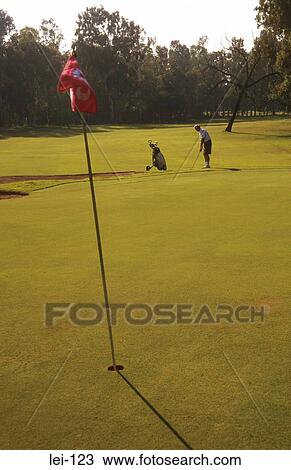 Stock Image - View down Fairway from Green on Golf Course. Fotosearch