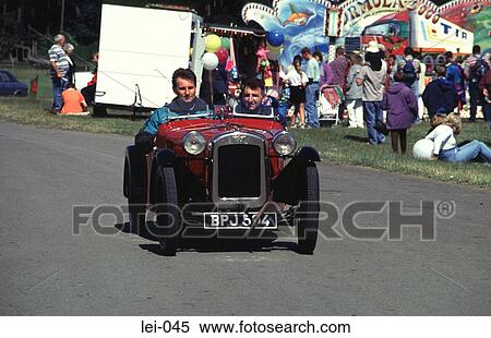 Vintage Car and Passengers at Car Fair View Large Photo Image Stock Photography - Vintage Car and Passengers at Car Fair. Fotosearch
