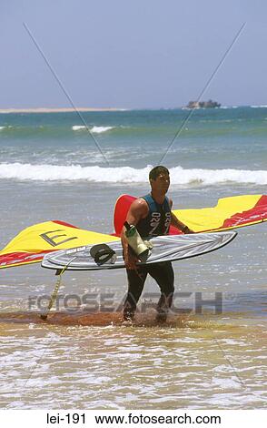 Windsurfer Carrying Equipment View Large Photo Image Stock Image - Windsurfer Carrying Equipment. Fotosearch