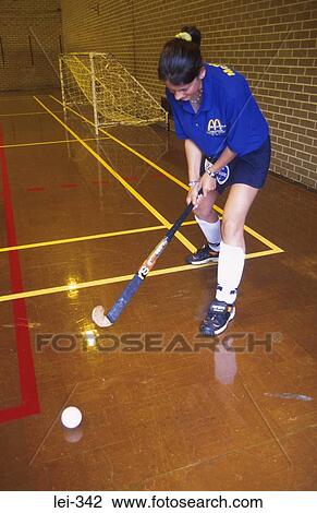 Stock Image - Woman Playing Hockey Leisure. Fotosearch