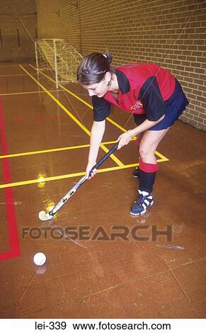 Stock Photo - Woman Playing Hockey Leisure. Fotosearch