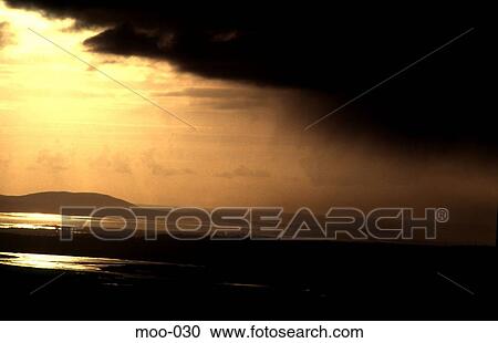Stock Image - Yellow Tinted View of Raining Clouds UK. Fotosearch