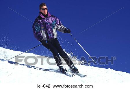 Stock Image - Young Man Skiing. Fotosearch
