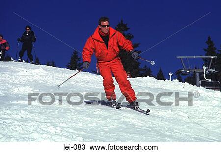 Young Man Skiing Wearing Red Snow Suit View Large Photo Image Stock Image - Young Man Skiing Wearing Red Snow Suit. Fotosearch