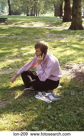 Young Man Using Mobile Phone St James Park London UK View Large Photo Image Stock Photo - Young Man Using Mobile Phone St James Park London UK. Fotosearch