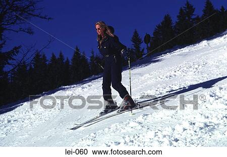 Young Woman Skiing View Large Photo Image Stock Image - Young Woman Skiing. Fotosearch