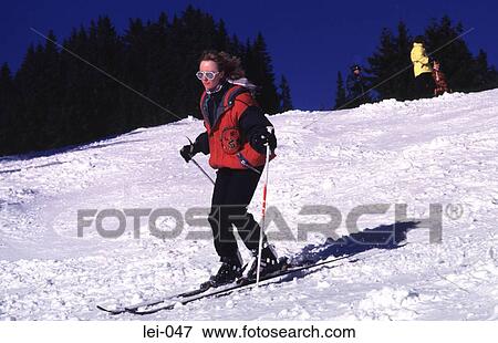 Young Woman Skiing View Large Photo Image Stock Photo - Young Woman Skiing. Fotosearch