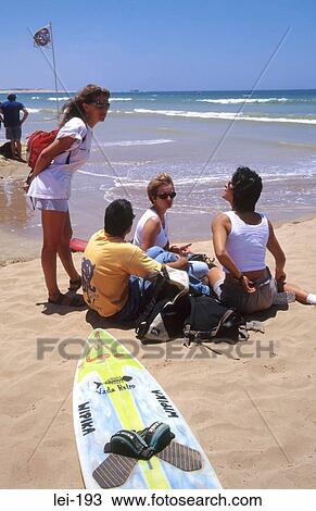 Young Women Talking on Beach View Large Photo Image Stock Image - Young Women Talking on Beach. Fotosearch