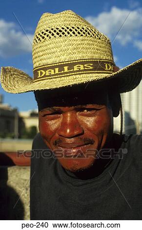Stock Image - Black South African Man in Straw Hat. Fotosearch