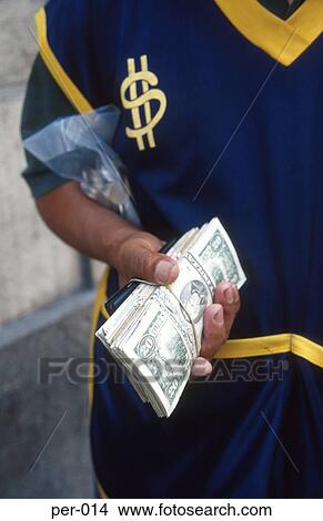 Picture - Blackmarketeer Carrying Large amounts of Cash Peru. Fotosearch