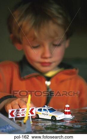 Boy Playing with Model Police Car View Large Photo Image Stock Image - Boy Playing with Model Police Car. Fotosearch
