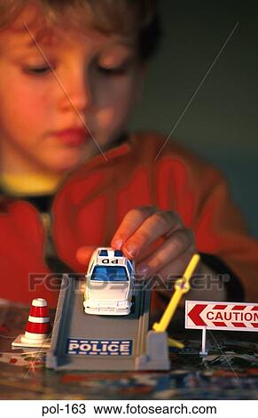 Boy Playing with Model Police Car View Large Photo Image Stock Image - Boy Playing with Model Police Car. Fotosearch