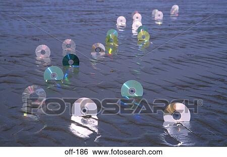 CD ROMs in Sand View Large Photo Image Stock Photograph - CD ROMs in Sand. Fotosearch