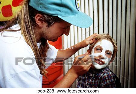 Child Having Face Painted UK View Large Photo Image Stock Photo - Child Having Face Painted UK. Fotosearch