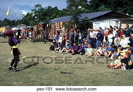 Children and Parents on a Lawn watching a Juggler View Large Photo Image Stock Image - Children and Parents on a Lawn watching a Juggler. Fotosearch