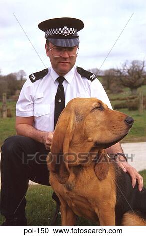 Stock Image - Close Up of Police Dog and Handler. Fotosearch