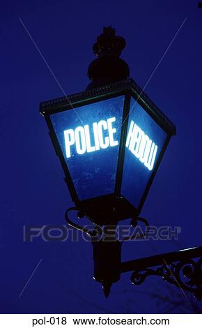 Stock Photo - Close Up of Police Station Blue Lamp at Night. Fotosearch