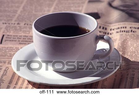 Stock Image - Coffee Cup on Financial Times. Fotosearch