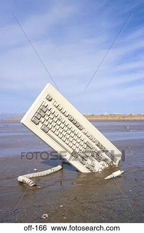 Stock Photograph - Computer Keyboard in Sandy Beach. Fotosearch