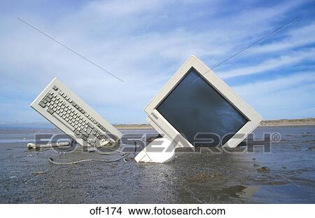 Computer Part Buried in Sand View Large Photo Image Picture - Computer Part Buried in Sand. Fotosearch