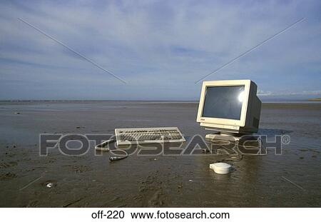 Stock Image - Computer Set up on Beach. Fotosearch
