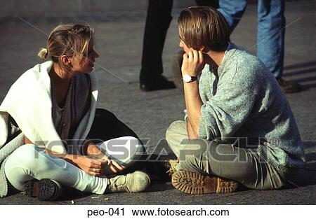 Couple of Teenagers Sitting on Floor Talking View Large Photo Image Stock Image - Couple of Teenagers Sitting on Floor Talking. Fotosearch