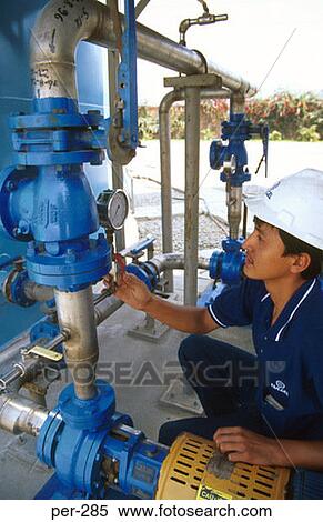 Stock Photography - Engineer Inspecting Gauge Edegel Power Station Lima Peru. Fotosearch
