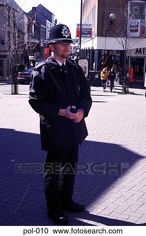 Stock Image - Full Length Picture of Policeman on Beat. Fotosearch