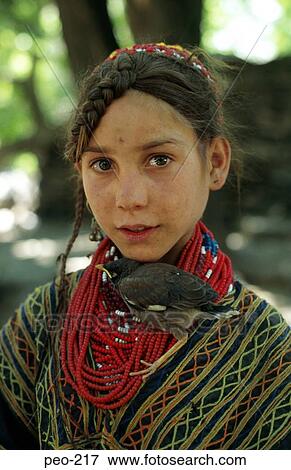 Stock Photo - Girl with Songbird Pakistan. Fotosearch