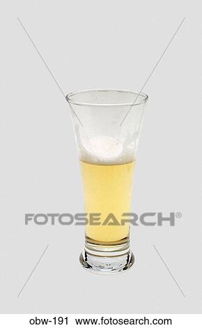 Stock Image - Half Empty (or Half Full) Glass of Lager. Fotosearch