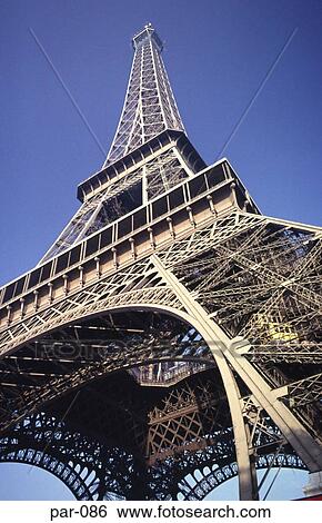 Stock Photograph - Lift at Base of the Eiffel Tower Paris France. Fotosearch