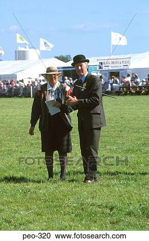 Stock Image - Man and Woman Judging Country Fair Wales UK. Fotosearch