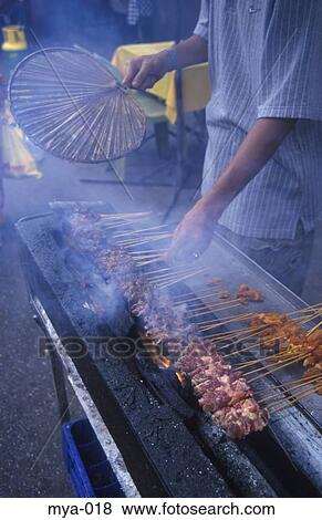 Man Cooking Skewered Meat Kuala Lumpur Malaysia View Large Photo Image Stock Photo - Man Cooking Skewered Meat Kuala Lumpur Malaysia. Fotosearch