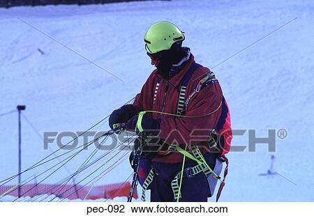 Man Disentangling Paraglider in the Snow Austria View Large Photo Image Stock Image - Man Disentangling Paraglider in the Snow Austria. Fotosearch