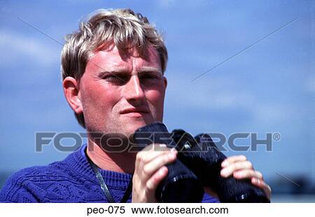 Man Holding Binoculars View Large Photo Image Stock Photography - Man Holding Binoculars. Fotosearch