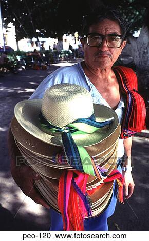 Stock Image - Man Holding Hats for Sale Mexico. Fotosearch